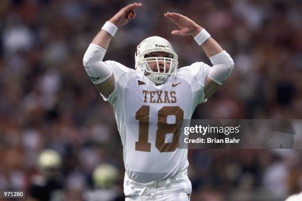 Quarterback Beau Trahan of the Texas Longhorns celebrates against the Colorado Buffalos during the Big 12 Championship game on December 1, 2001 at...