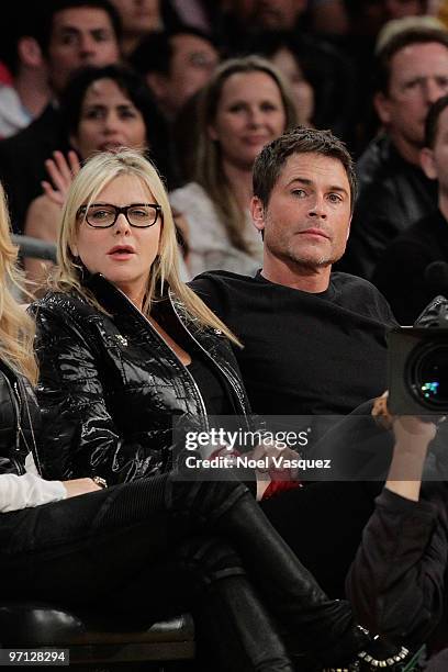 Rob Lowe and his wife attend a game between the Philadelphia 76ers and the Los Angeles Lakers at Staples Center on February 26, 2010 in Los Angeles,...