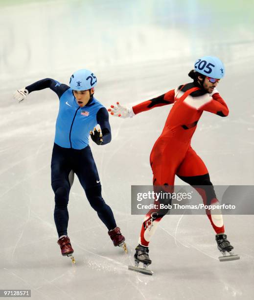 Charles Hamelin of Canada celebrates victory over the disqualified Apolo Anton Ohno of the United States in the Men's 500m Short Track Speed Skating...