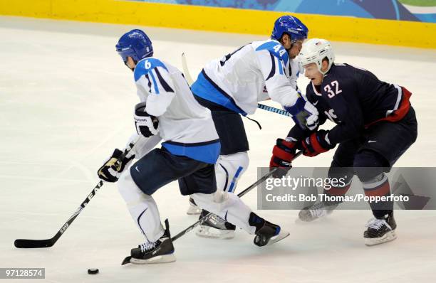 Dustin Brown of the USA with Sami Salo and Kimmo Timonen of Finland during the ice hockey men's semifinal game between the United States and Finland...