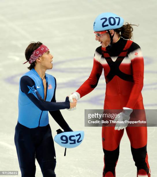 Relay Gold medalist Jean Oliver of Canada shakes hands with bronze medalist Apolo Anton Ohno of the United States after the Men's 5000m Relay Short...