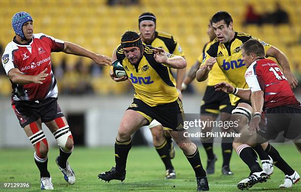 Andrew Hore of the Hurricanes breaks away to score a try during the round three Super 14 match between the Hurricanes and the Lions at Westpac...