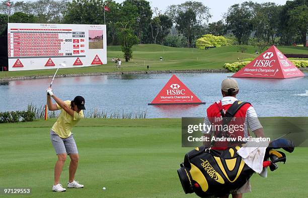Juli Inkster of the USA plays her second shot on the 18th hole during the third round of the HSBC Women's Champions at the Tanah Merah Country Club...