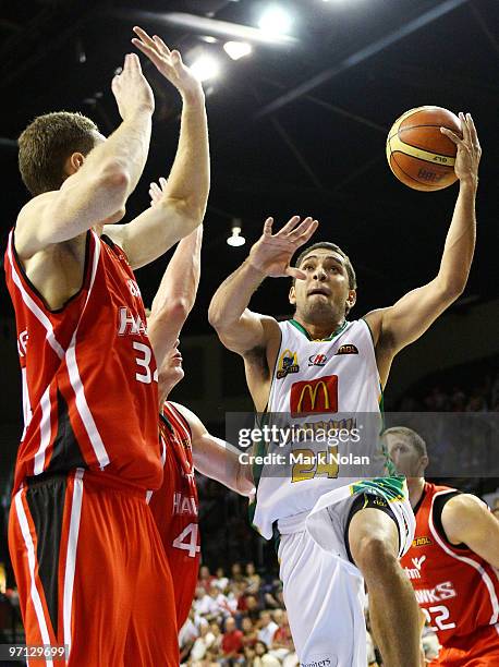 Michael Cedar of Townsville drives to the basket during game three of the NBL semi final series between the Wollongong Hawks and the Townsville...