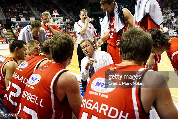 Hawks coach Gordie McLeod speaks to his players during game three of the NBL semi final series between the Wollongong Hawks and the Townsville...