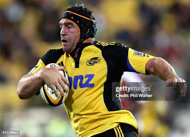 Andrew Hore of the Hurricanes breaks away to score a try during the round three Super 14 match between the Hurricanes and the Lions at Westpac...