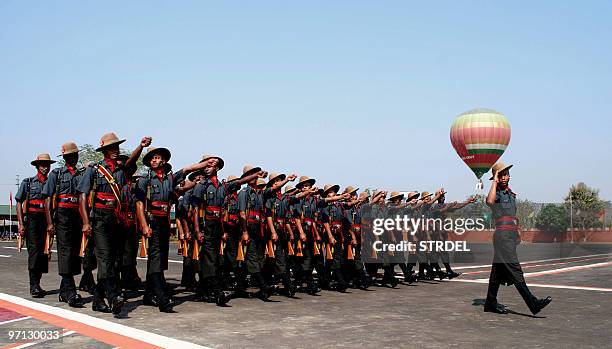 Indian soldiers from The Assam Rifles march past during a parade,part of a ceremony for celebrations of the 175th anniversary of Assam Rifles, at The...