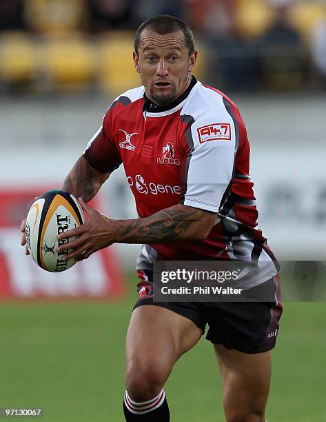 Carlos Spencer of the Lions runs the ball forward during the round three Super 14 match between the Hurricanes and the Lions at Westpac Stadium on...