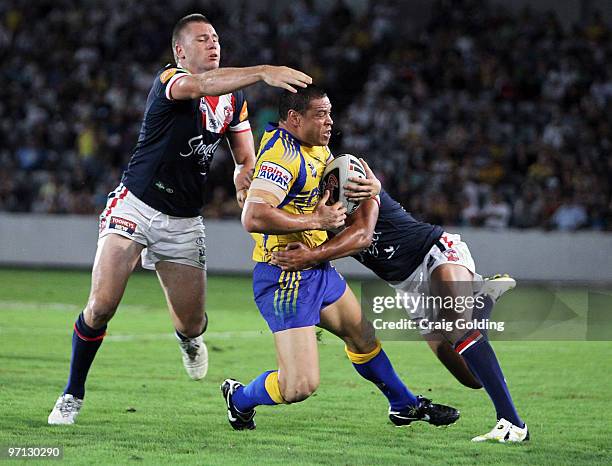 Timana Tahu of the Eels is tackled during the NRL trial match between the Sydney Roosters and the Parramatta Eels at Bluetongue Stadium on February...