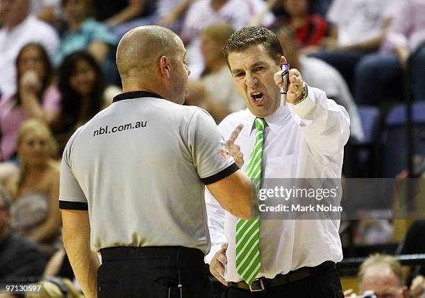 Townsville coach Trevor Gleeson disputes a decision with a referee during game three of the NBL semi final series between the Wollongong Hawks and...