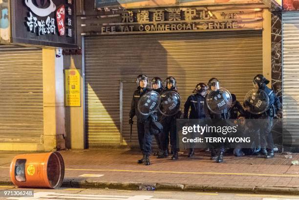 In this photo taken on February 9 a group of police arrest a protestor during clashes, later dubbed the "Fishball Revolution", in the Mongkok area of...