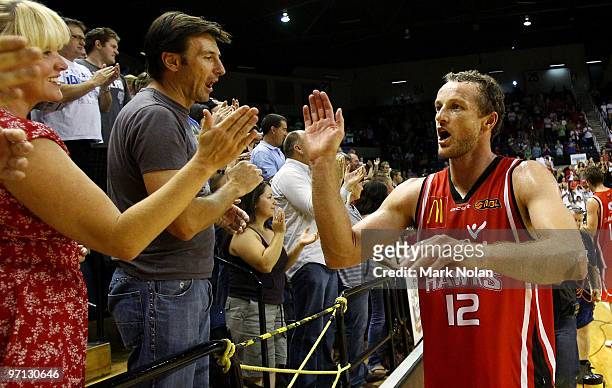 Glen Saville of the Hawks celebrates with fans after winning game three of the NBL semi final series between the Wollongong Hawks and the Townsville...