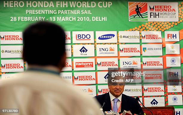 International Hockey Federation President Leandro Negre listens to a journalist complain at a press conference in New Delhi on February 27, 2010....