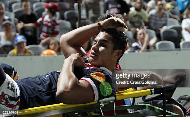 Anthony Cherrington of the Roosters is stretchered off during the NRL trial match between the Sydney Roosters and the Parramatta Eels at Bluetongue...