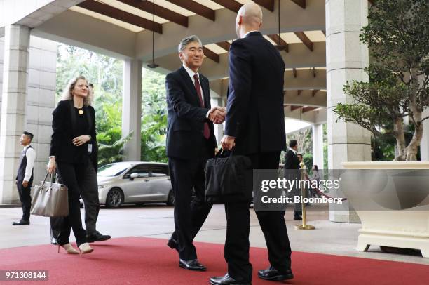 Sung Kim, U.S. Ambassador to the Philippines and former special representative for North Korea policy, center, shakes hands with a U.S. Official as...