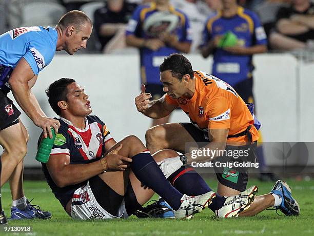 Anthony Cherrington of the Roosters is injured during the NRL trial match between the Sydney Roosters and the Parramatta Eels at Bluetongue Stadium...