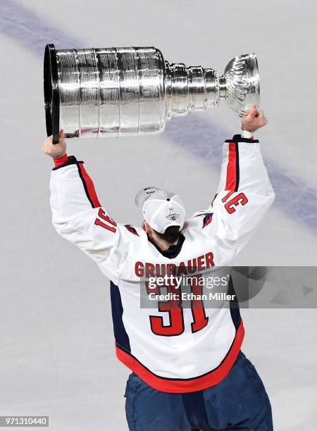 Philipp Grubauer of the Washington Capitals hoists the Stanley Cup after Game Five of the 2018 NHL Stanley Cup Final at T-Mobile Arena on June 7,...