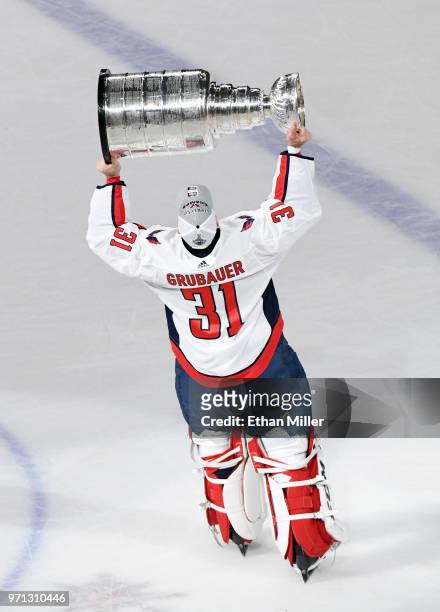 Philipp Grubauer of the Washington Capitals hoists the Stanley Cup after Game Five of the 2018 NHL Stanley Cup Final at T-Mobile Arena on June 7,...