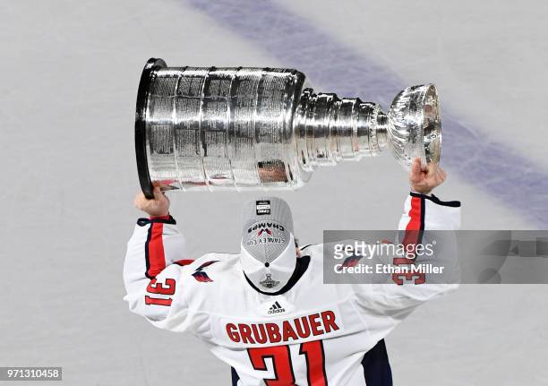 Philipp Grubauer of the Washington Capitals hoists the Stanley Cup after Game Five of the 2018 NHL Stanley Cup Final at T-Mobile Arena on June 7,...