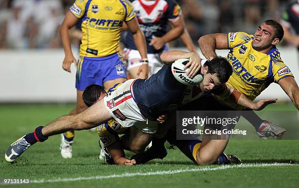 Aidan Guerra of the Roosters scores during the NRL trial match between the Sydney Roosters and the Parramatta Eels at Bluetongue Stadium on February...