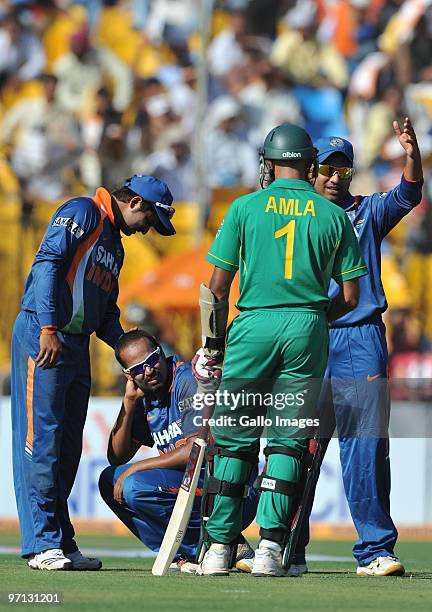 Yusuf Pathan of India injured after collission with Hashim Amla of South Africa during the 3rd ODI between India and South Africa from Sardar Patel...