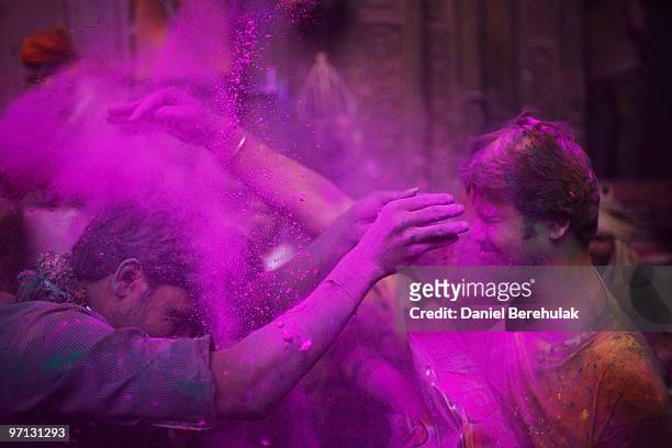 Hindu devotees play with colour during Holi celebrations at the Bankey Bihari Temple on February 27, 2010 in Vrindavan, India. The tradition of...