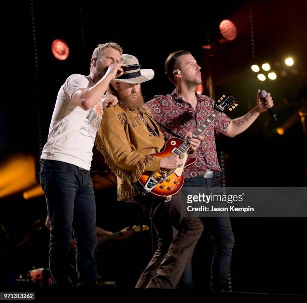 Dierks Bentley, John Osborne and T.J Osborne of musical duo Brothers Osborne perform onstage during the 2018 CMA Music festival at Nissan Stadium on...