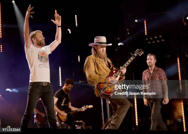 Dierks Bentley, John Osborne and T.J Osborne of musical duo Brothers Osborne perform onstage during the 2018 CMA Music festival at Nissan Stadium on...