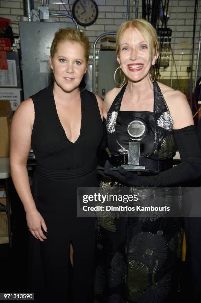 Amy Schumer and Catherine Zuber pose backstage during the 72nd Annual Tony Awards at Radio City Music Hall on June 10, 2018 in New York City.