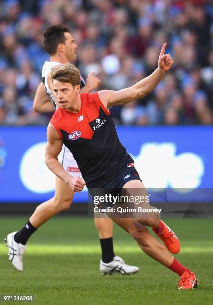 Mitch Hannan of the Demons celebrates kicking a goal during the round 12 AFL match between the Melbourne Demons and the Collingwood Magpies at...