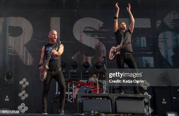 Guitarist Zach Blair and singer Tim McIlrath of the band Rise Against perform at Download Festival at Donington Park on June 10, 2018 in Castle...
