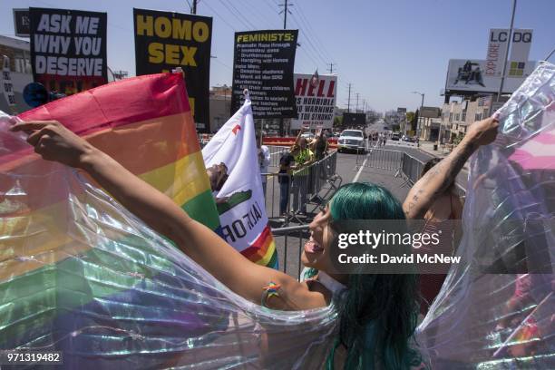 McKenzie Santa Maria dances in front of provocative evangelical street preachers calling out insults at people participating in the 48th annual LA...