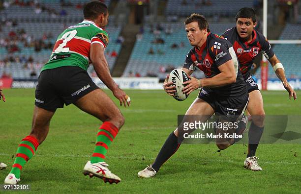 Brett Morris of the Dragons heads for the tryline during the NRL Charity Shield match between the South Sydney Rabbitohs and the St George Illawarra...