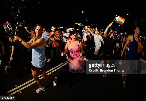Parade goers dance during the annual Sydney Gay and Lesbian Mardi Gras Parade on Oxford Street on February 27, 2010 in Sydney, Australia. The annual...
