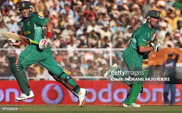 South African cricketers Jacques Kallis and AB de Villiers take a run during the third and final One Day International match between India and South...