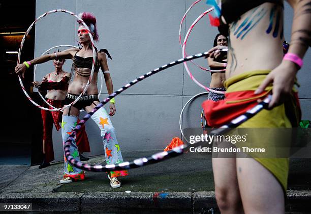 Parade goers prepare prior to the parade during the annual Sydney Gay and Lesbian Mardi Gras Parade on Oxford Street on February 27, 2010 in Sydney,...