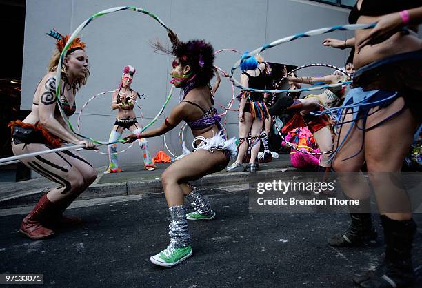 Parade goers prepare prior to the parade during the annual Sydney Gay and Lesbian Mardi Gras Parade on Oxford Street on February 27, 2010 in Sydney,...