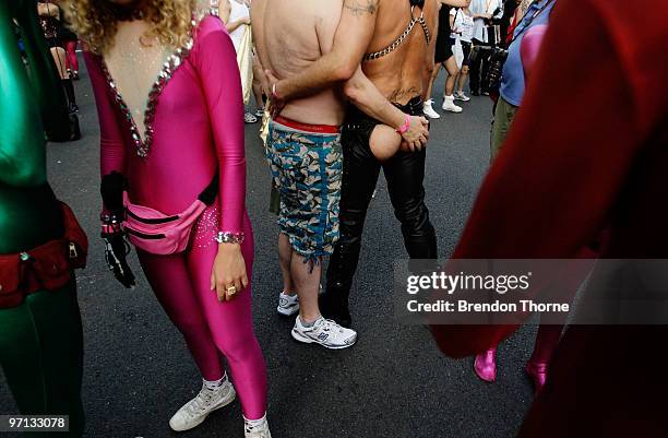 Parade goers prepare prior to the parade during the annual Sydney Gay and Lesbian Mardi Gras Parade on Oxford Street on February 27, 2010 in Sydney,...