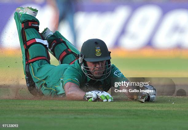 De Villiers of South Africa dives to avoid a run out during the 3rd ODI between India and South Africa from Sardar Patel Stadium on February 27, 2010...