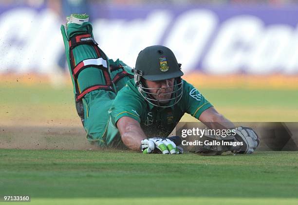 De Villiers of South Africa dives to avoid a run out during the 3rd ODI between India and South Africa from Sardar Patel Stadium on February 27, 2010...