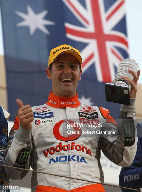 Jamie Whincup driver of the Team Vodafone Holden celebrates after winning race two for round two of the V8 Supercar Championship Series at Bahrain...