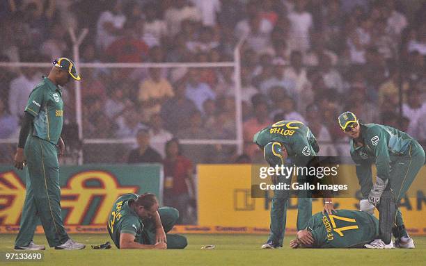 Jacques Kallis and AB de Villiers of South Africa lie injured after colliding as they went for the same catch during the 3rd ODI between India and...