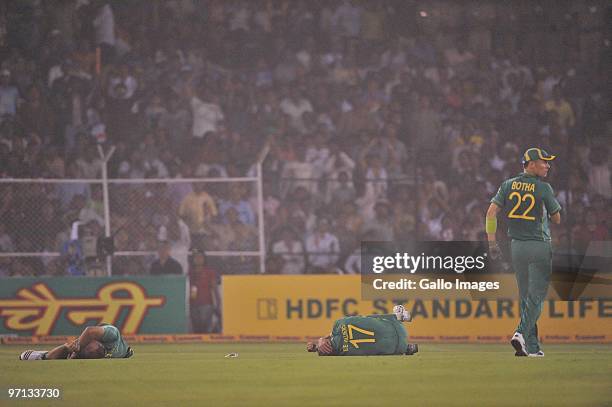 Jacques Kallis and AB de Villiers of South Africa lie injured after colliding as they went for the same catch during the 3rd ODI between India and...