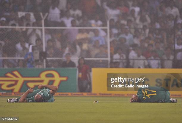 Jacques Kallis and AB de Villiers of South Africa lie injured after colliding as they went for the same catch during the 3rd ODI between India and...