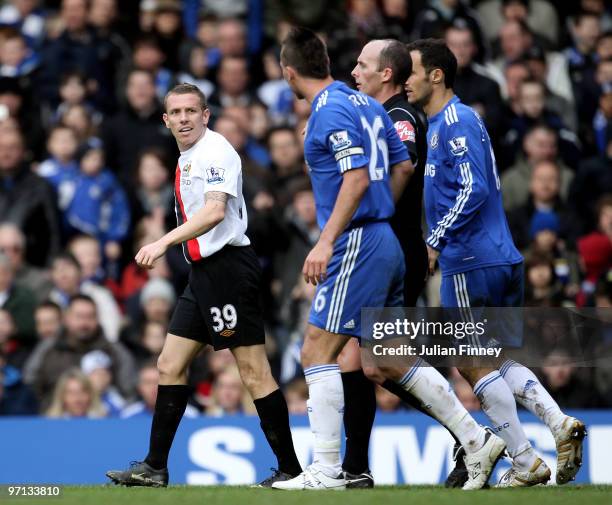 John Terry of Chelsea and Craig Bellamy of Manchester City exchange words during the Barclays Premier League match between Chelsea and Manchester...