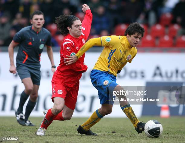 Mirko Boland of Braunschweig battles for the ball with David Ulm of Offenbach during the Third Liga match between Eintracht Braunschweig and Kickers...