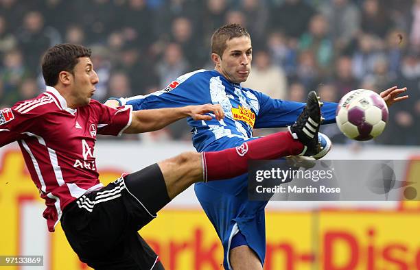 Stanislav Sestak of Bochum and Dominic Maroh of Nuernberg compete for the ball during the Bundesliga match between VFL Bochum and 1. FC Nuernberg at...