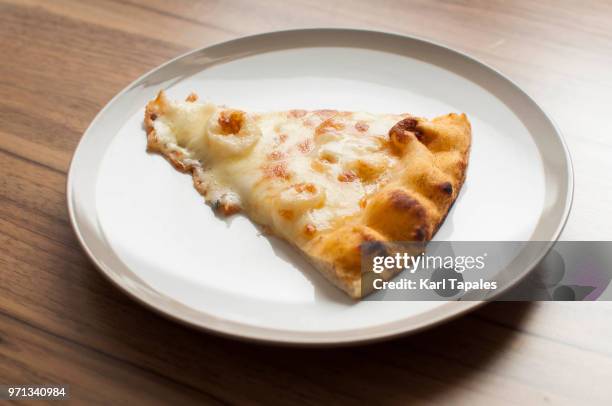 four cheese pizza on a white plate - white pizza stock pictures, royalty-free photos & images