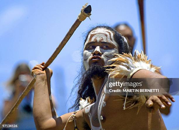 Native man, with his face painted as the old Polynesian Matamua warriors, throws a spear during the traditional Tapati festival of the Rapanu...
