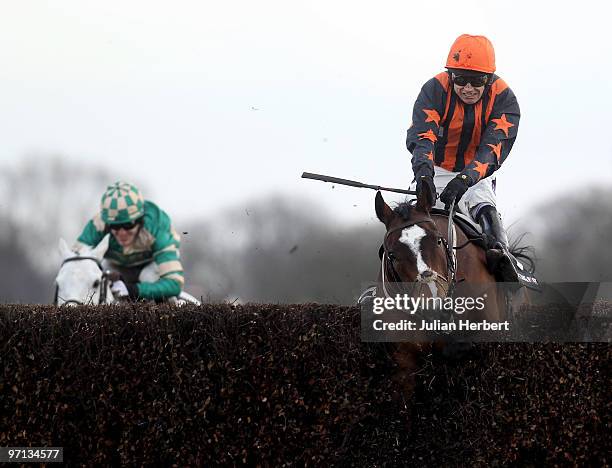 Paddy Brennan and Razor Royale lead the Tony McCoy ridden Nacarat over the last fence before going on to win The Racing Post Steeple Chase Race run...